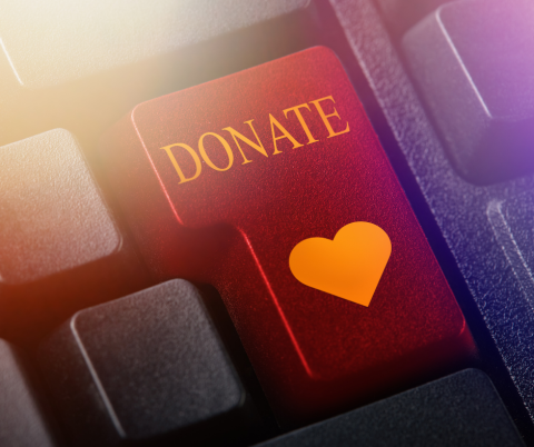 Keyboard with button that has a heart and the word "donate"