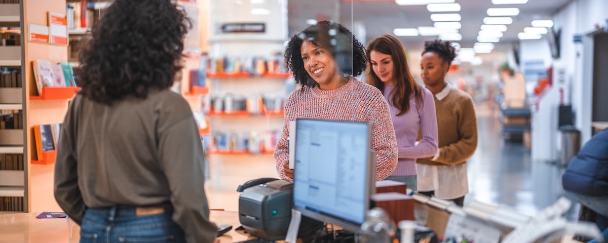 Woman at front desk of library