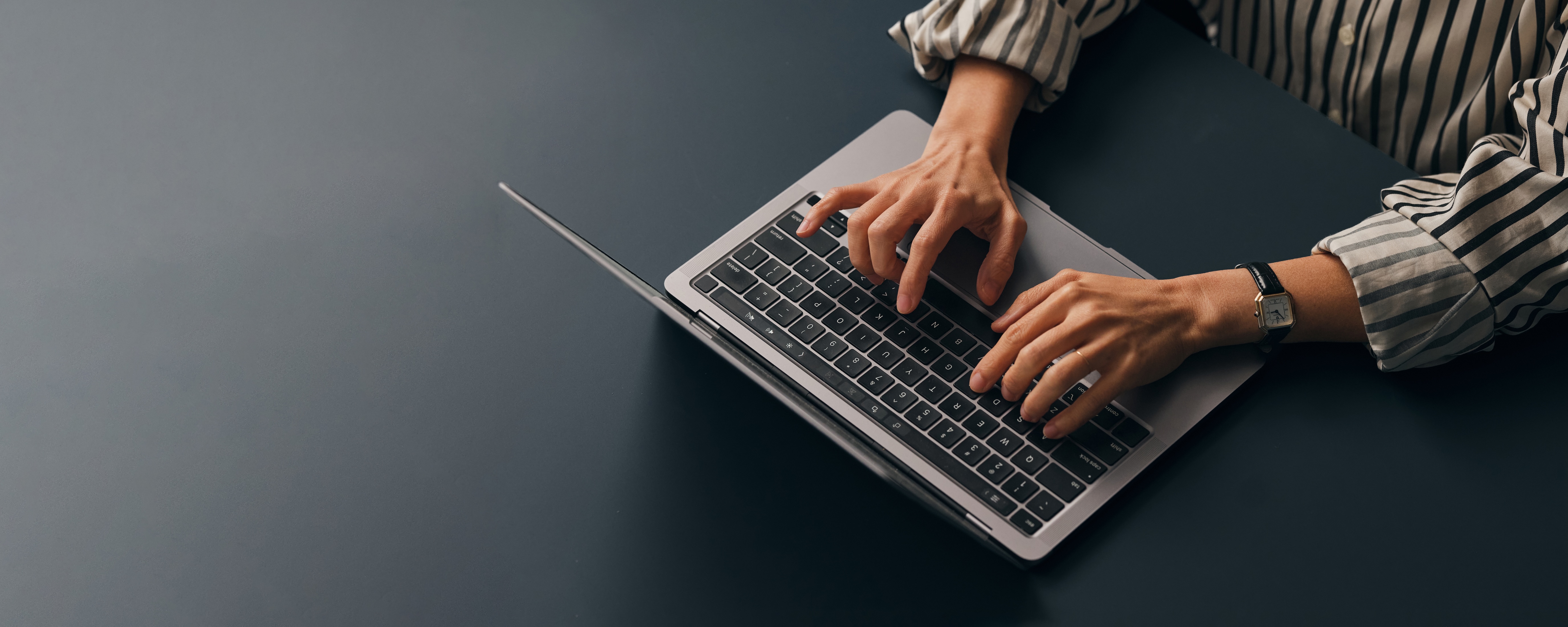 Person typing on laptop