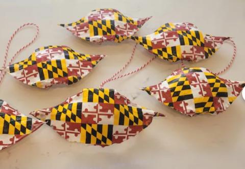 5 blue crab shells, each painted with the Maryland Flag