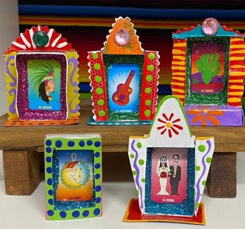 Five colorful ofrendas made from matchboxes