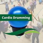picture of exercise ball and people using drumsticks