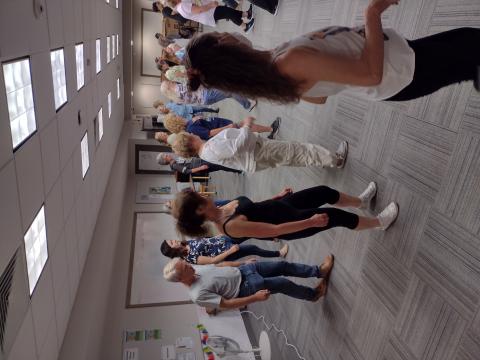 a group of people dancing in lines