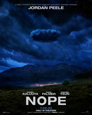 Poster for the film Nope. In a dark stormy and cloudy sky there is a suspicious cloud with a flagged streamer hanging down from it. The rest of the image is of a lonely gulch with a lit up western theme park in the distance.