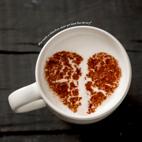 Mug with broken heart latte art and the words "Who needs a Valentine when you have the library?"