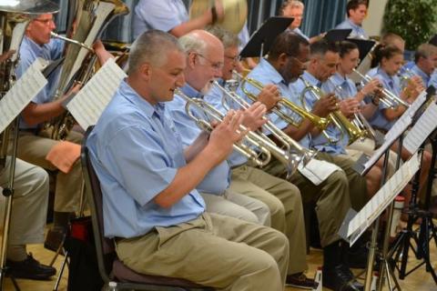 Trumpet players and other musicians in Bay Winds playing concert music