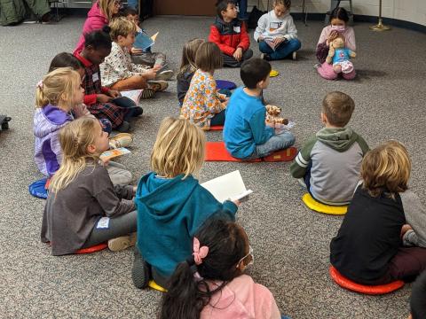 a group of children sitting on the floor together